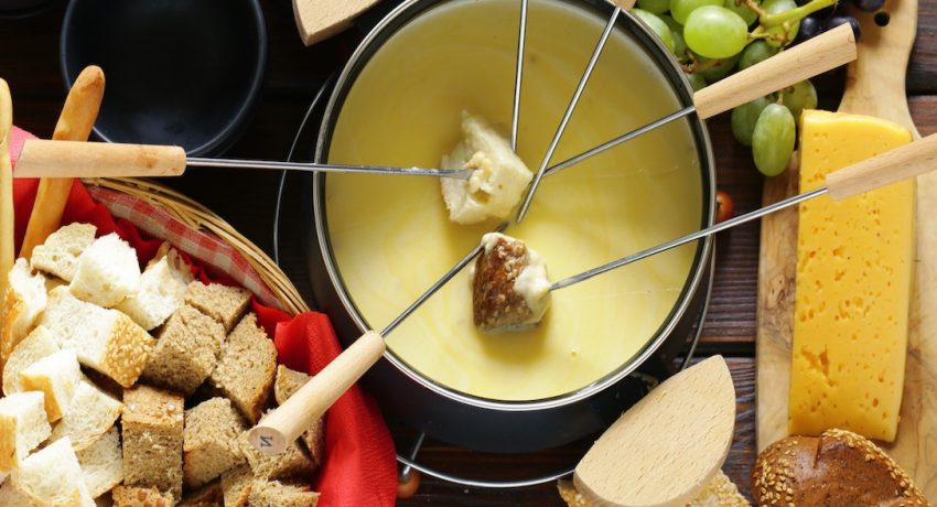 cheese fondue with bread in a special dish