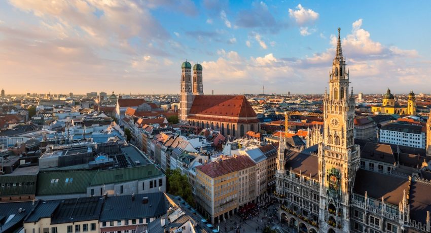 Aerial view of Munich - Marienplatz, Neues Rathaus and Frauenkirche from St. Peter's church on sunset. Munich, Germany