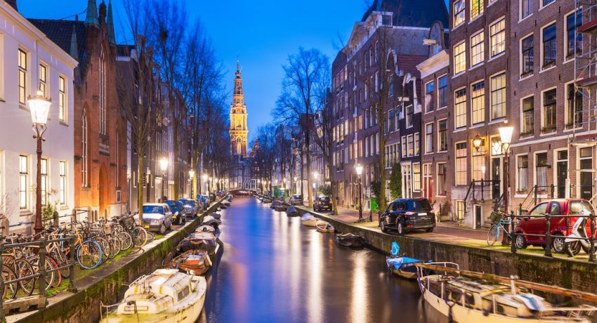 Amsterdam, Netherlands cityscape on the canals with Zuiderkerk.