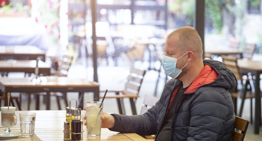 Man in restaurant during coronavirus pandemic.